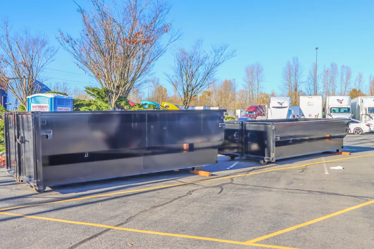 Professional dumpster rental service with roll-off container on residential driveway in Gages Lake